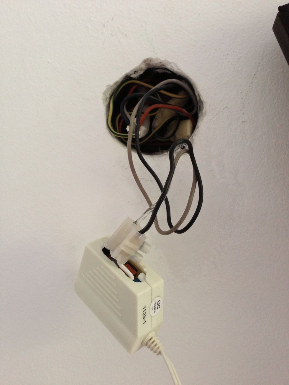 You have to open (in this case crack open) the transformer of the LED light strip. Attach it to power using an insulating screw joint. As always: Don't electrocute yourself!