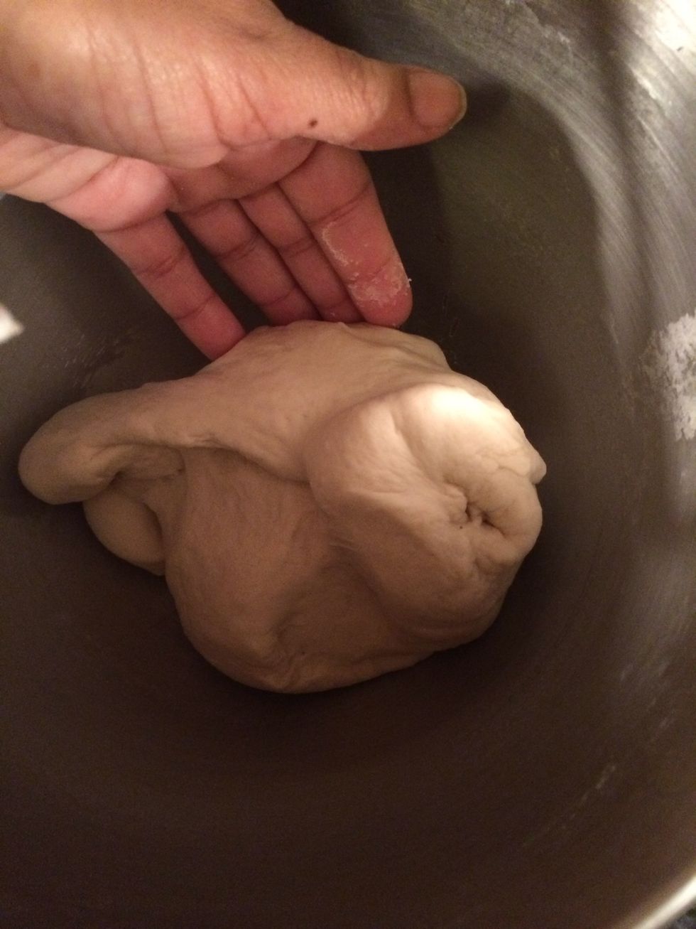 You know its ready when the dough isn't too sticky or wet. It is time to let it rest.