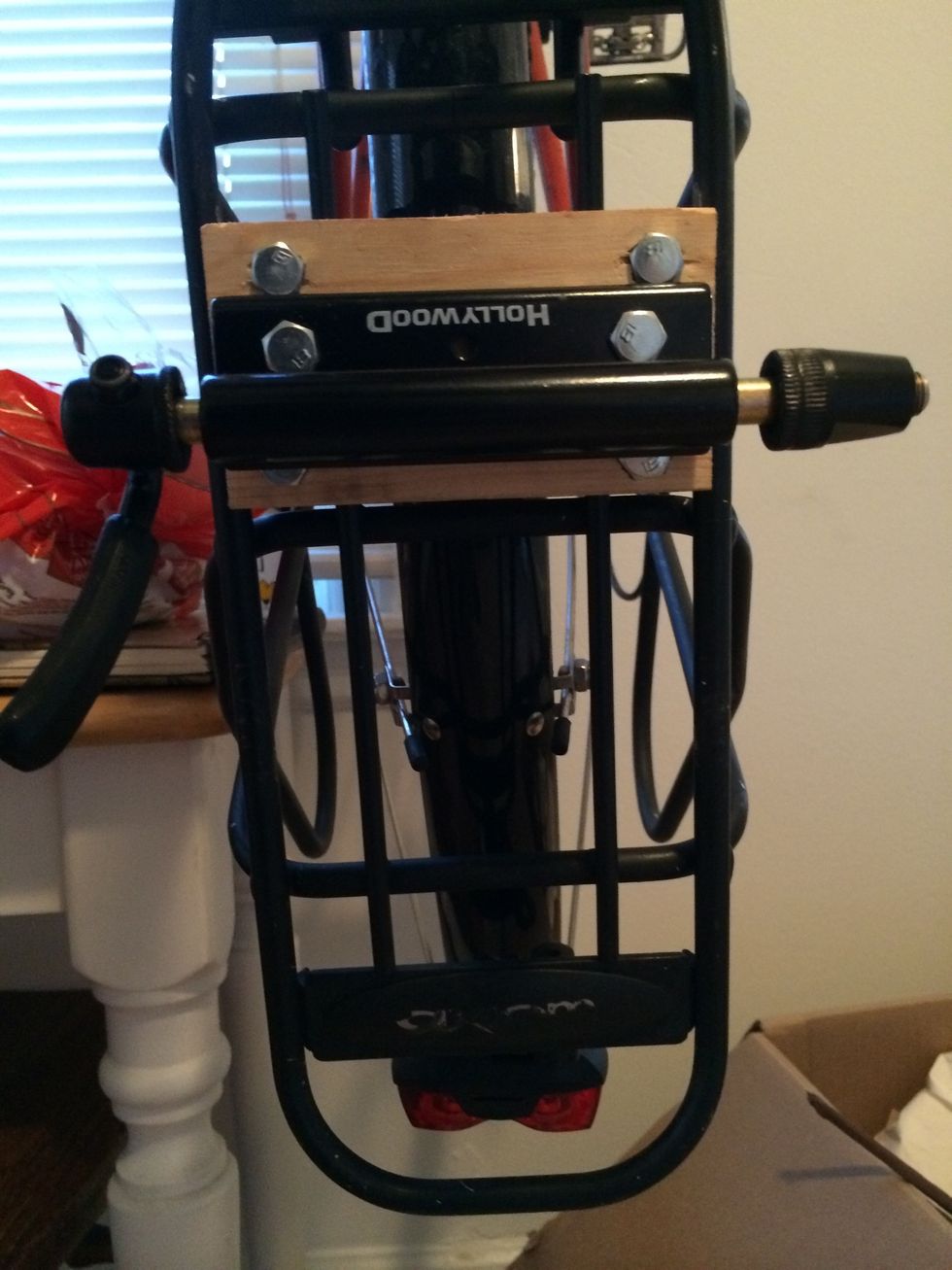 You'll also want to mark and drill for each hole on the fork mount. When you do that, you'll run two more bolts and tighten down your mount. It's ok if the mount rests on the nuts as long as it's even