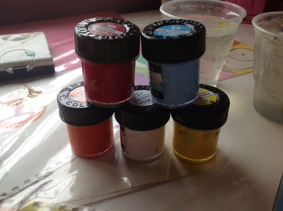 You'll be needing yellow, orange, red, blue and white paints. Its up to you if you want to use poster paints or watercolours.