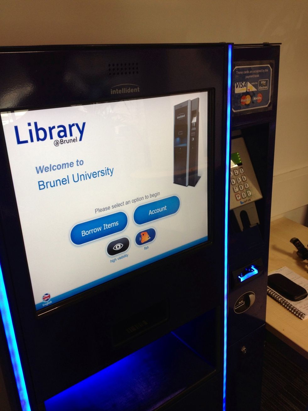 You'll find three issue machines near the main Library entrance - we're using the one with a payment unit, that's the only difference between the machines.