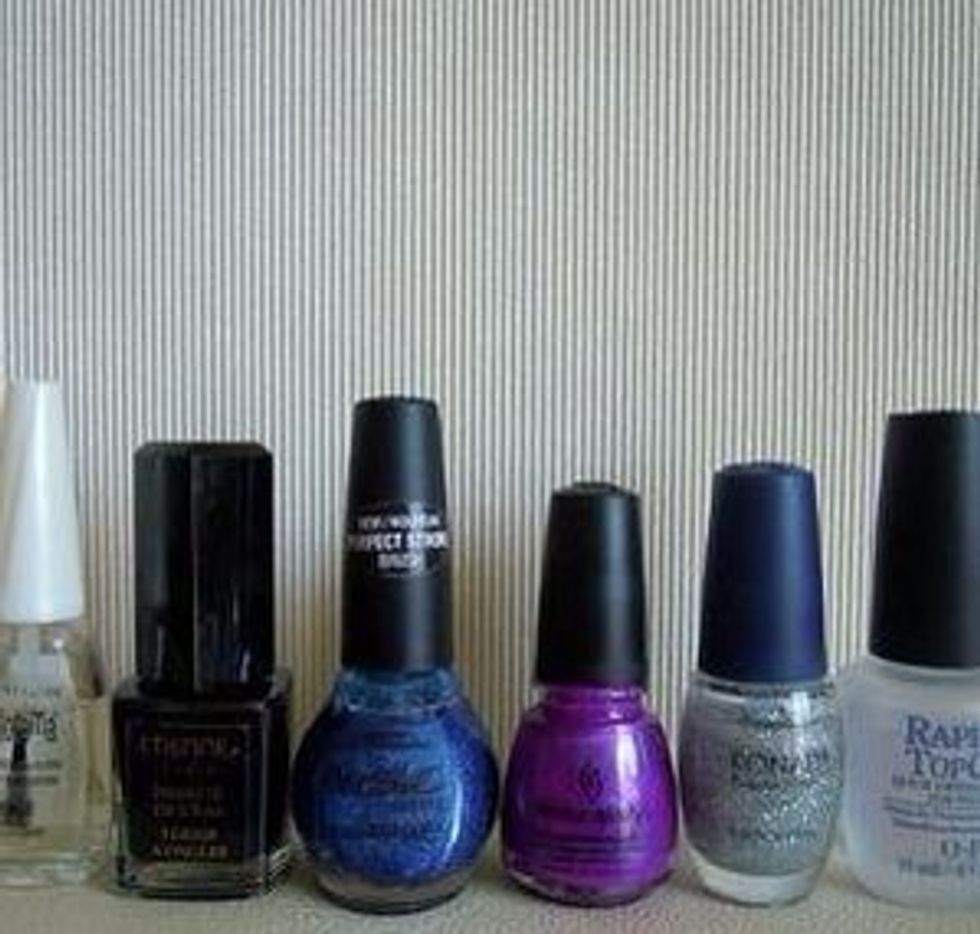 You'll need: a base coat, black nail polish, blue polish, purple polish, silver glitter polish, a top coat and a foundation rectangular sponge.