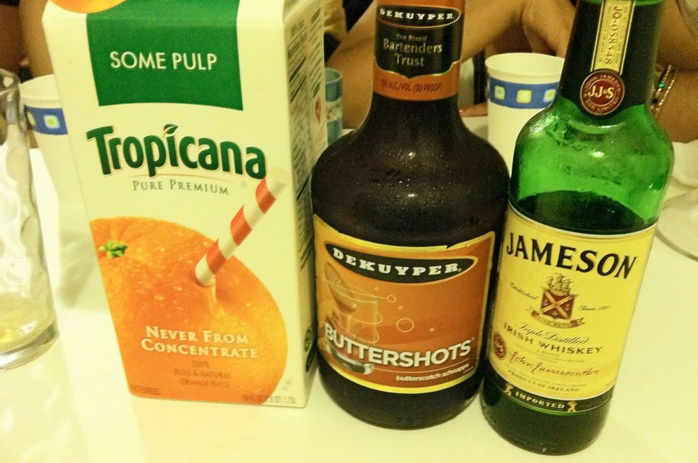 You'll need a bottle of Jameson Whiskey, a bottle of butterscotch schnapps, a strip of bacon (optional) and some OJ. Take out your shot glass!!