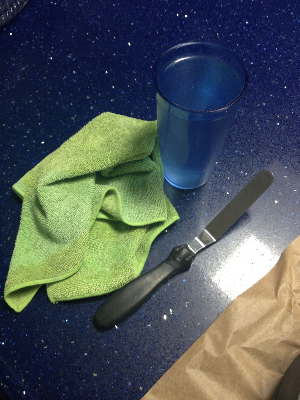 You'll need a cup of boiling water, and icing spreader, and a clean rag