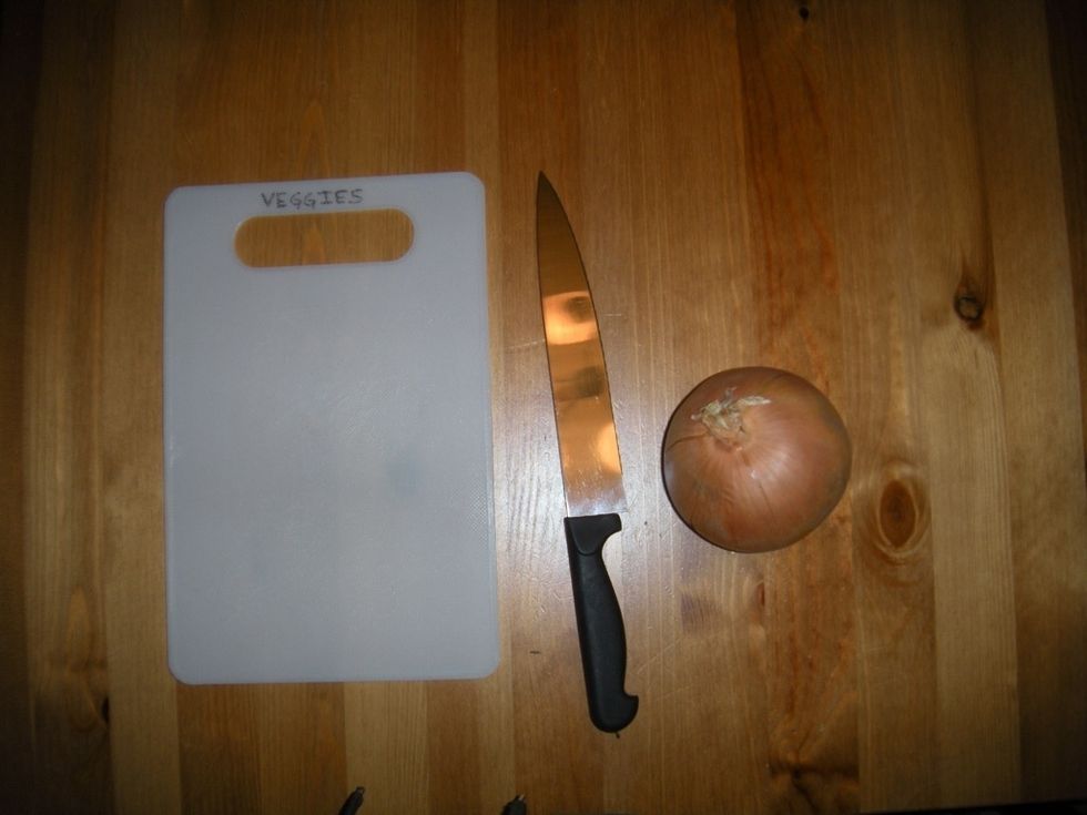 You'll need a cutting board, knife, and an onion. Use a board that is only used for vegetables, never for meat. Place your onion in the freezer 10 minutes before chopping to help prevent crying.