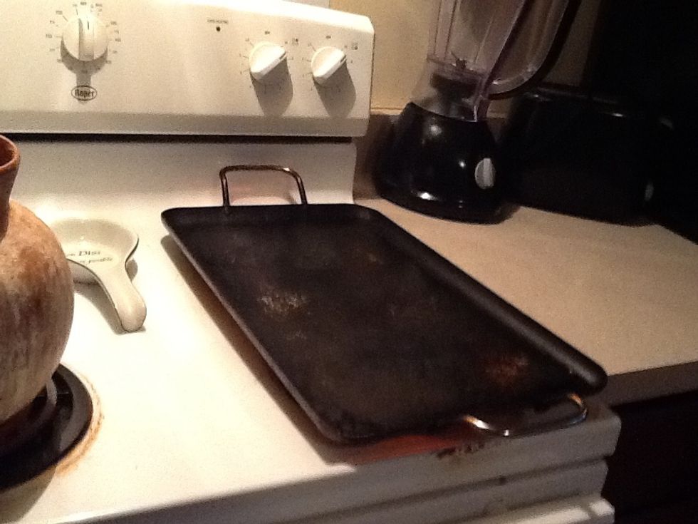 You'll need a flat griddle like this one ( or better know as a grill) place the stove on high it Must be very hot before starting to cook