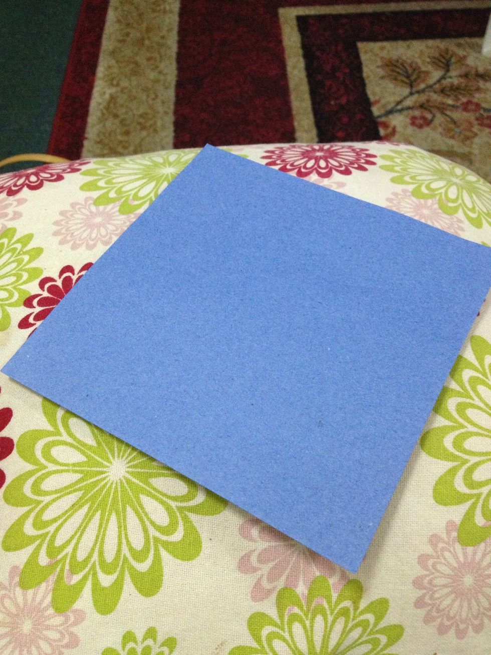 You'll need: A square colored paper (which the back is white) which is a little big than this. I am using a plain blue paper here. So, the back is not white.