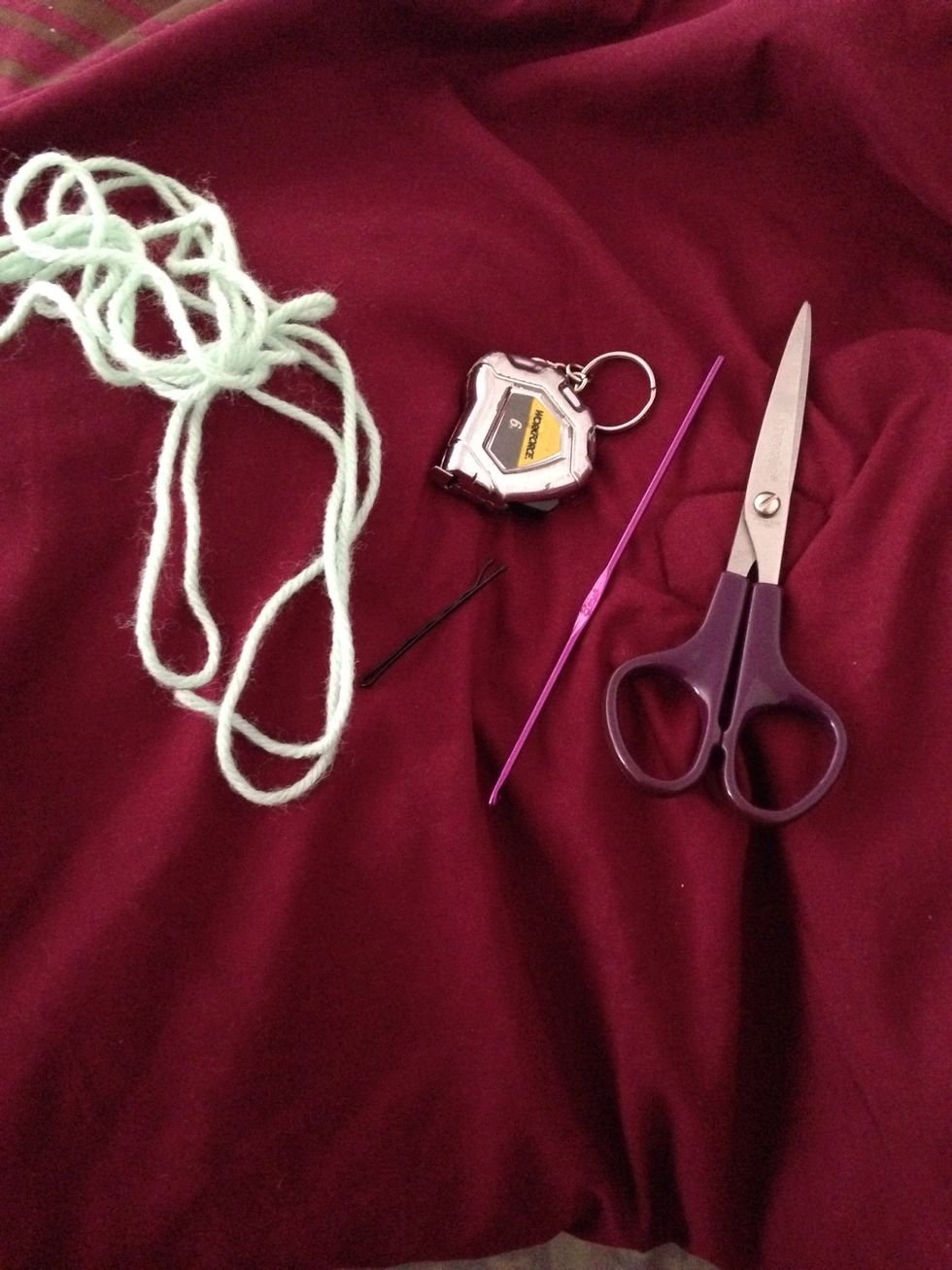 You'll need some yarn (I used worsted weight), size D (3.25MM) crochet hook, scissors, measuring tape, and 1 bobby pin
