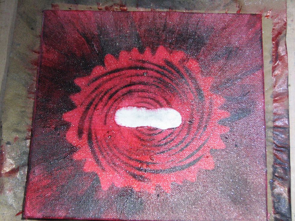You'll need to spray the canvas with a fixative to set the PanPastel.  As you can see some of the paint bled into the area reserved for the eyes...no worries...you'll see why in future steps.