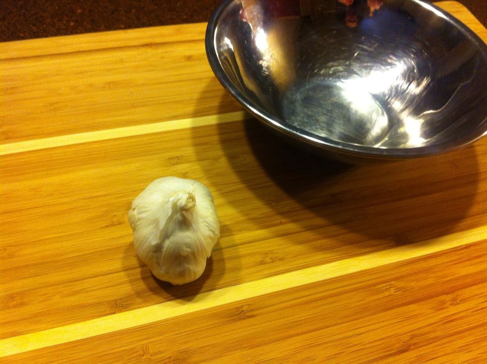 You'll need two bowls and a head of garlic. I use metal bowls, but just about any two bowls will work as long as they fit together snugly.