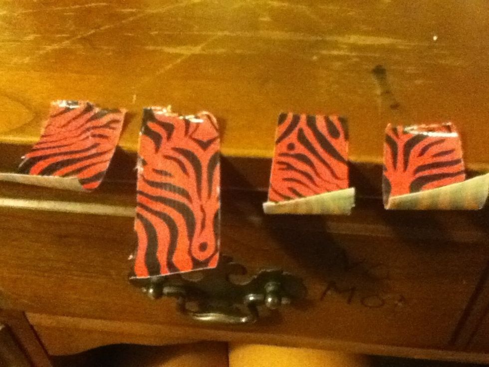 You'll need two pieces for each accent. I recommend scotch tape but I don't have any today so I'm using duct tape. For either kind, stick the tape repeatedly to your fingers to reduce the stickiness.