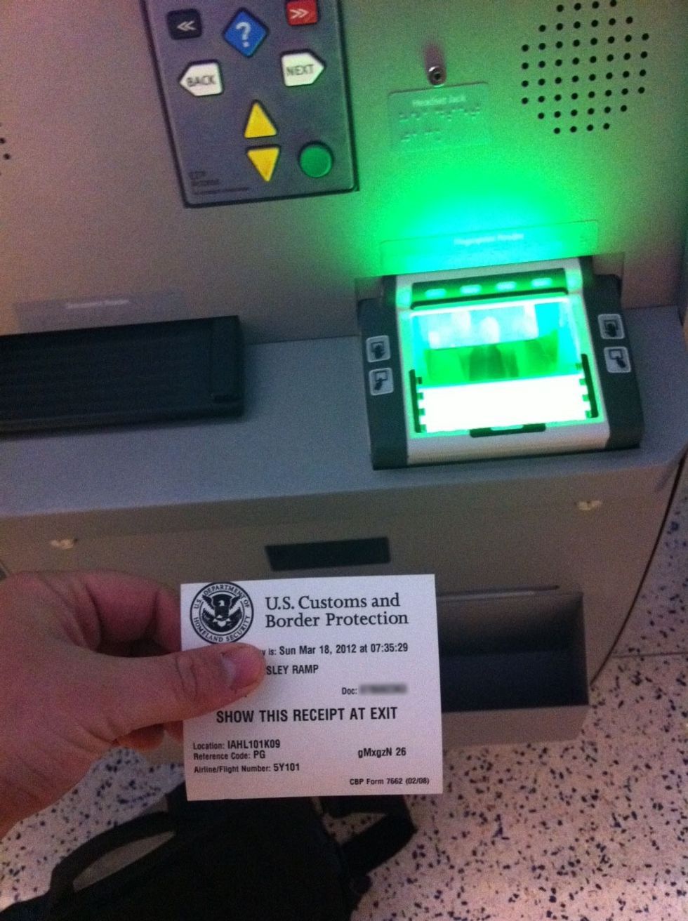 You'll receive a receipt from the kiosk that can now be given to the ICE officer waiting at the end of the Global Entry area.