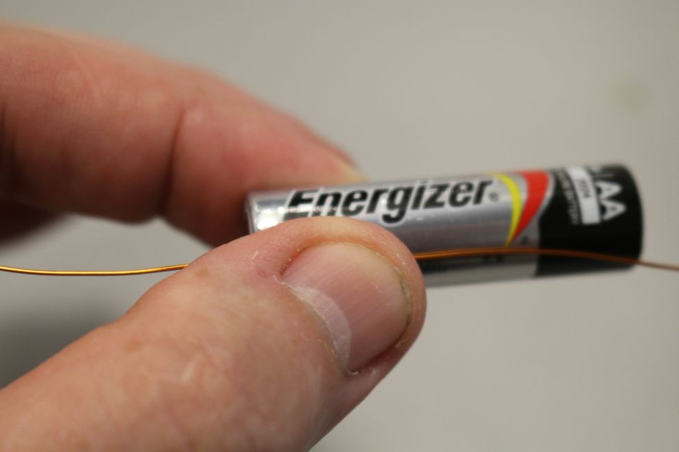 You'll use your battery to wrap the coil. Have about 2" of wire sticking out from the battery and hold it down against the battery and start coiling it around the battery.
