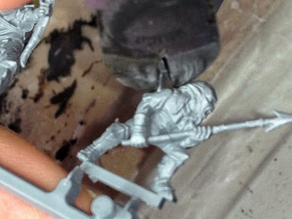 You'll usually have to cut near the actual miniature at some point so be extra careful here.