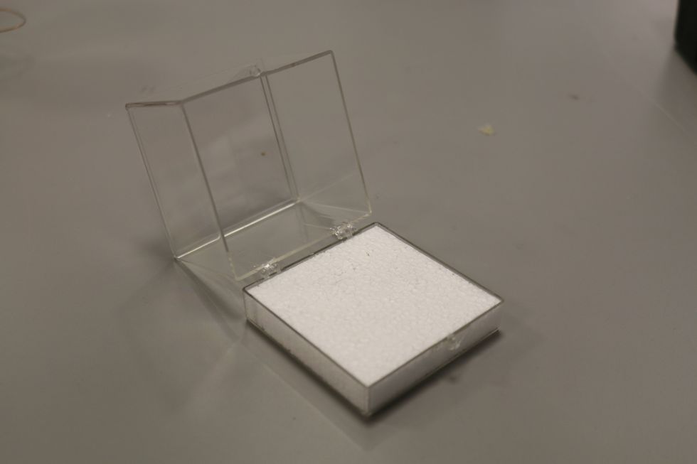 You'll want a block of styrofoam or wood to build your motor on. We were lucky to have plastic display boxes that worked well.