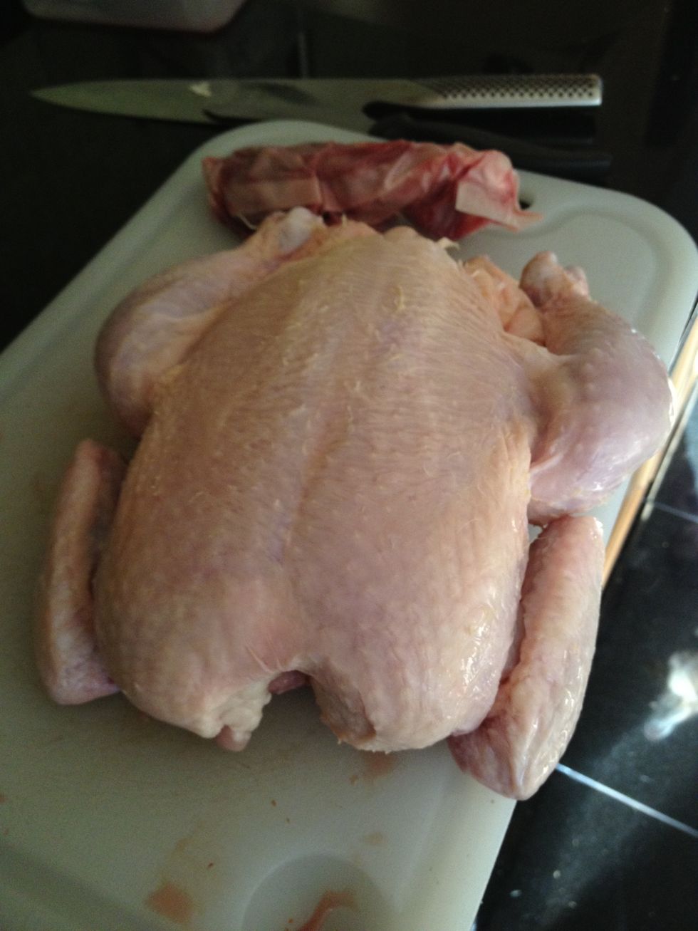 You'll want a smaller chicken because one of those mutant perdue birds won't fit in your grill standing up. Remove the giblets , wash and pat dry.