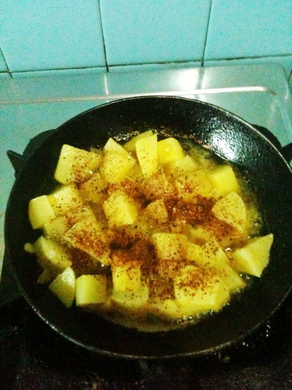 You may add some chili powder instead of peppers and salt on fried potatoes.