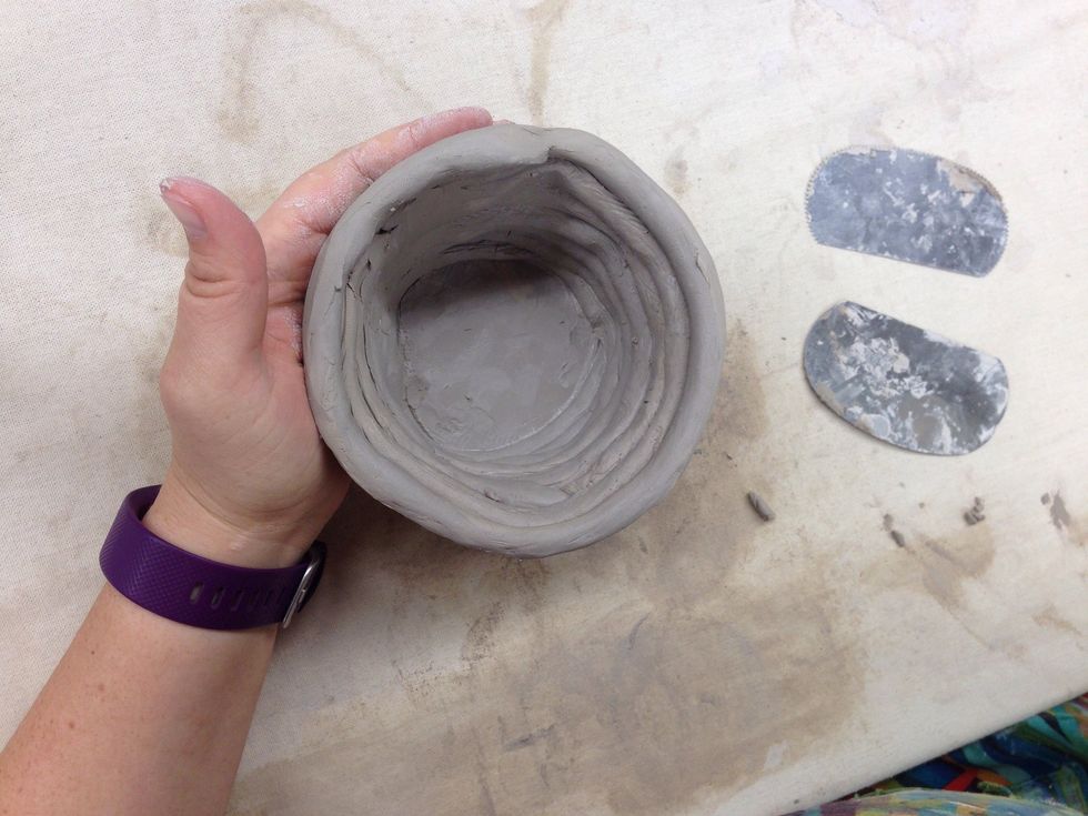 You may also smooth the inside of the pottery also.
