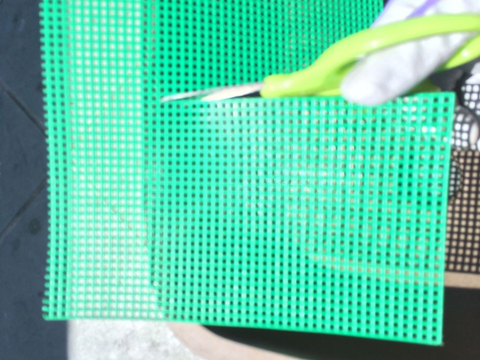 You may choose to wear a pair of gloves or not. Start by cutting your bonsai mesh in a square large enough to cover the pot hole (with half of an inch extra).