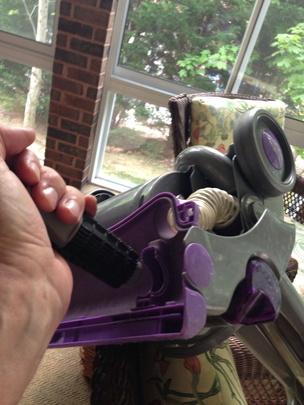 You may need to smash the inside of the housing with the butt end of a screw driver to seat the two fittings behind the housing into the vacuum base.