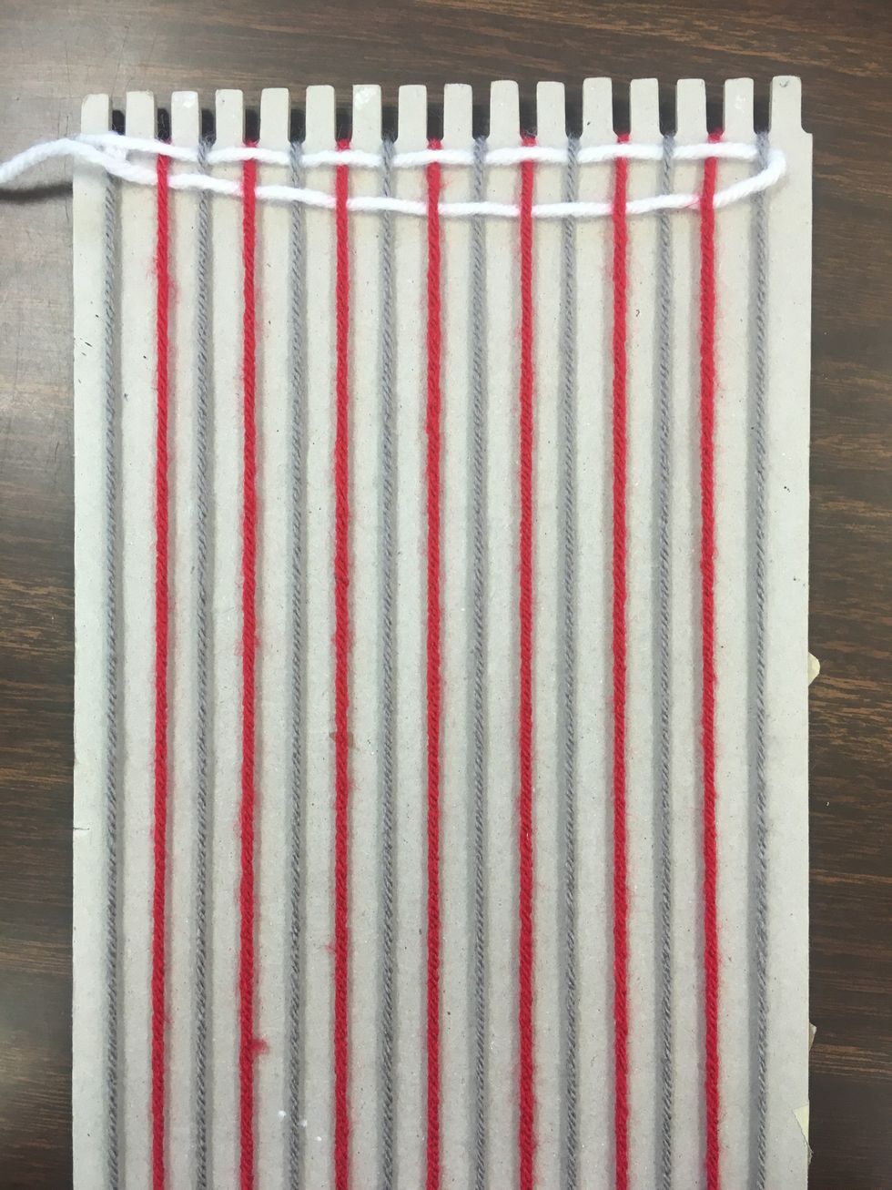 You may notice that your threads are not all at the top. You may use a comb, or even your own finger tips to push the thread up to the top to align with the first thread.