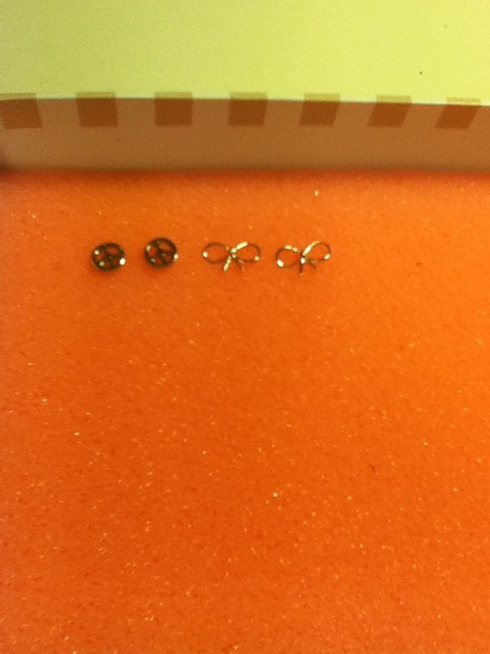 You may place your earrings inside the box!