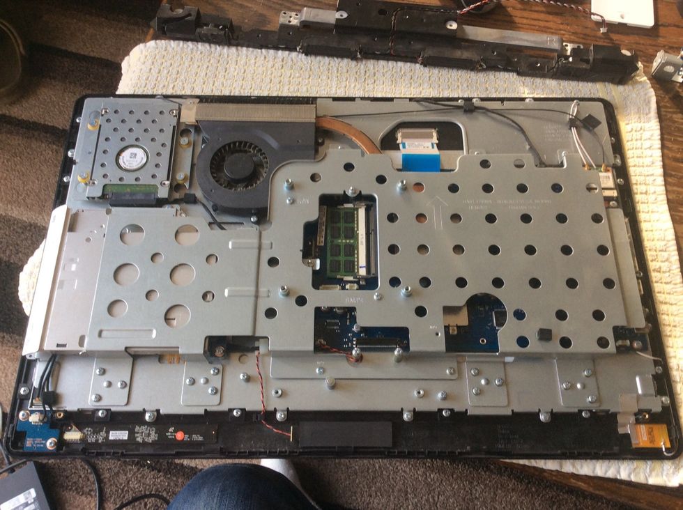 You might be able to work around without removing this top metal bracket, I however removed all the screws of which there are loads and removed the large metal piece & the DVD drive.