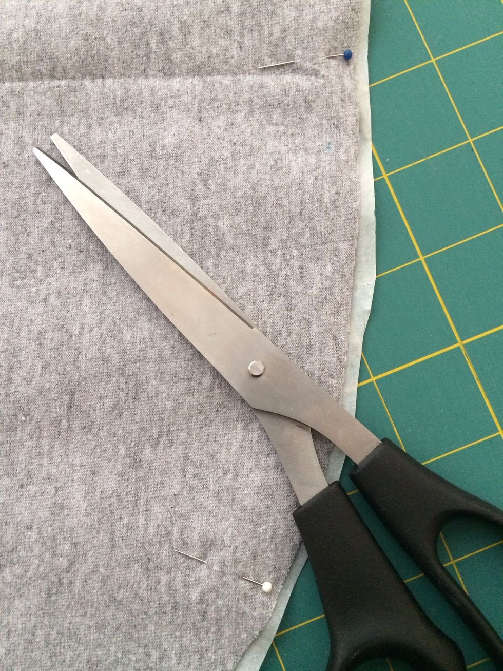 You might want to leave a bit of extra at the edges as knits shift as you iron them.