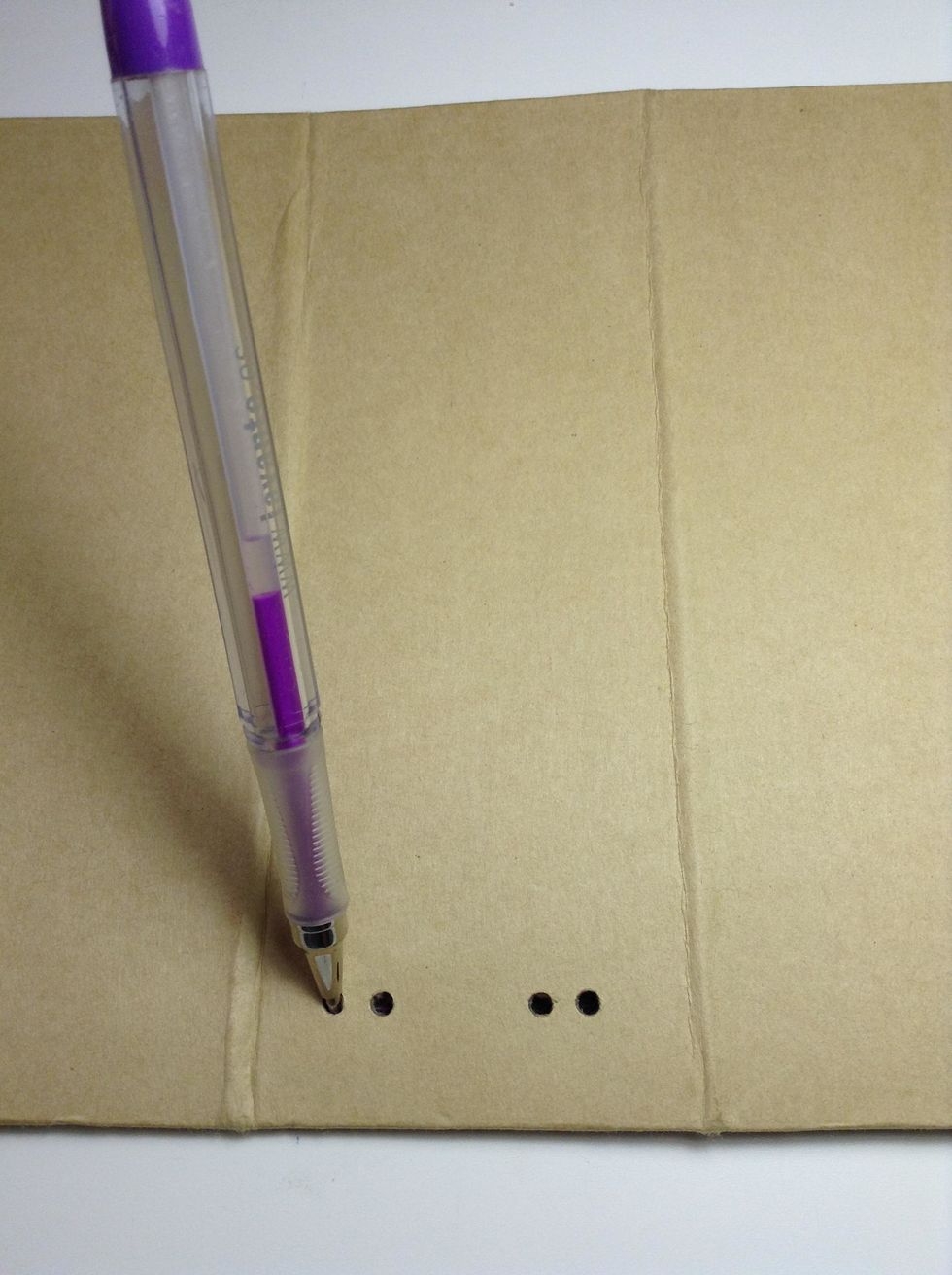 You must punch four small holes in the spine on top ...as shown.