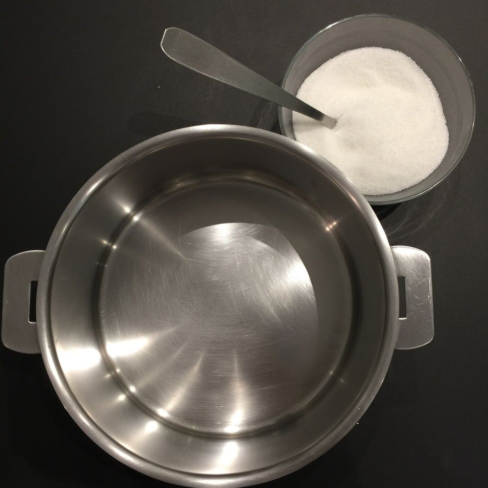 You need a pan or a cooking pot. It is important to use a pan that you can see the color of the caramel. And use white sugar. Also it is important to see the developing color of the caramel.