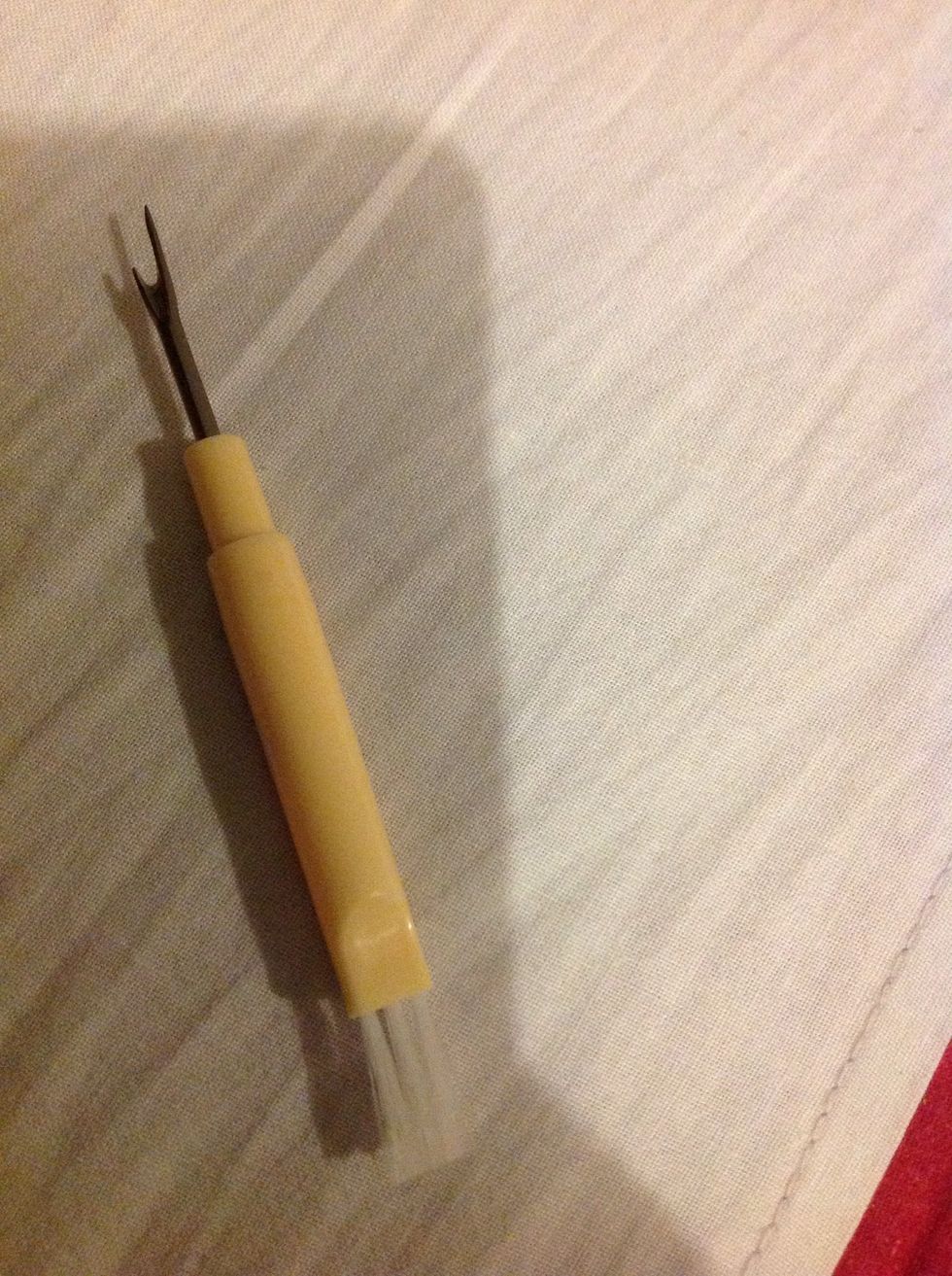 You need a seam ripper.