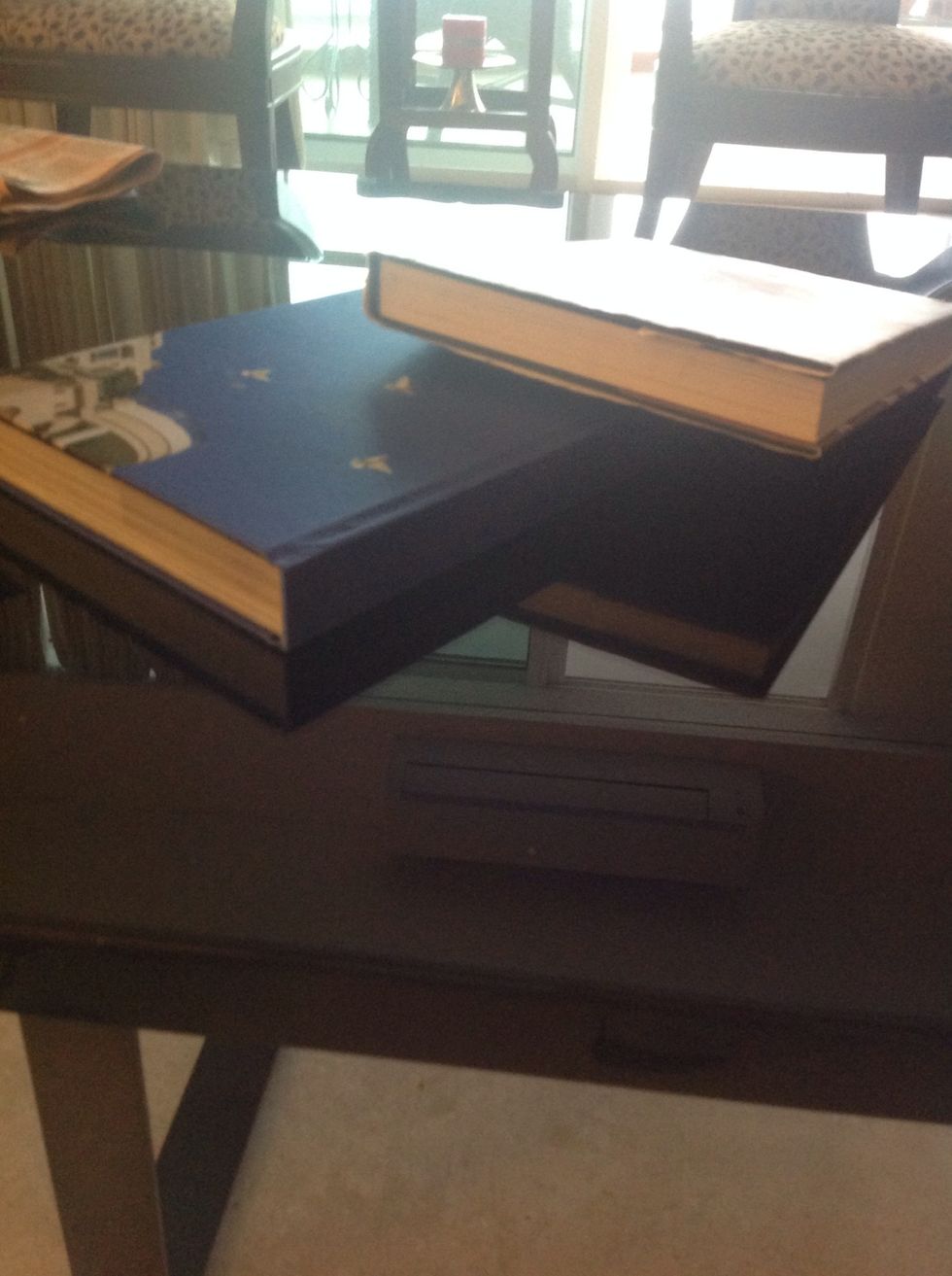 You need books this long or longer and this thick or thicker.