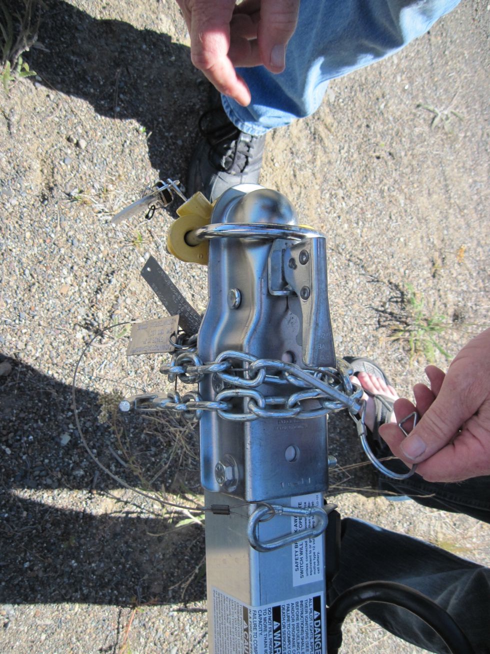 You need to pull the pin out, too. It looks like a nail, or a bolt, with a spring-loaded hook on it. It holds the lever down.