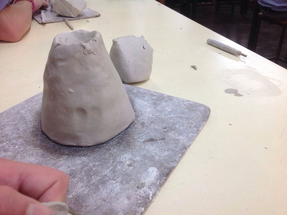 You need to shape your cube into a volcano shape with the top caved in a little