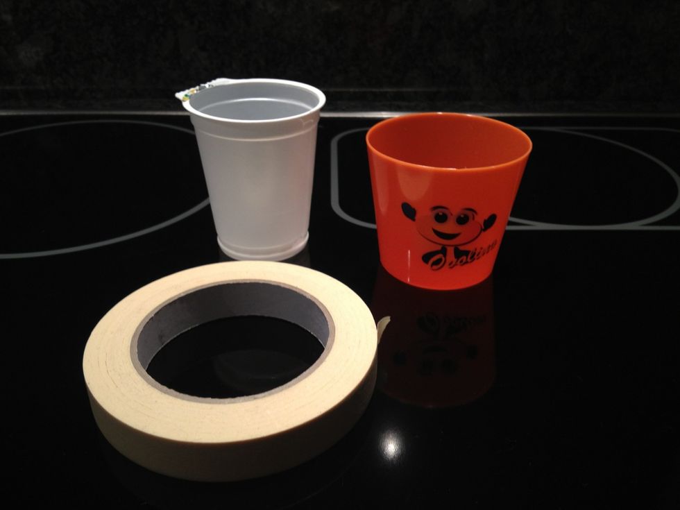 You need two plastic cups, one a bit wider than the other. And some tape. Scotch tape will do fine, I used masking tape.