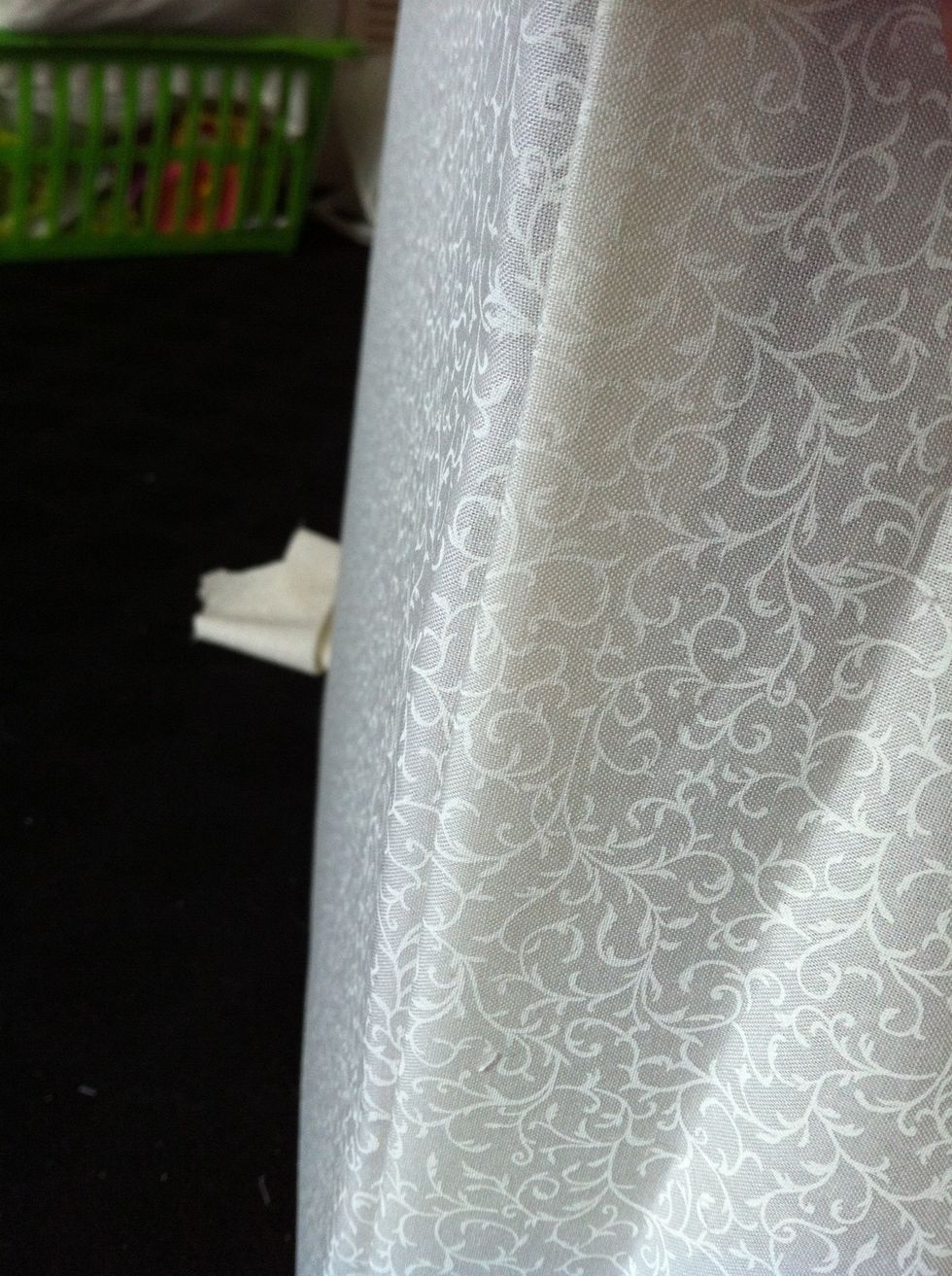 You now bring fabric round the correct way and staples remain hidden