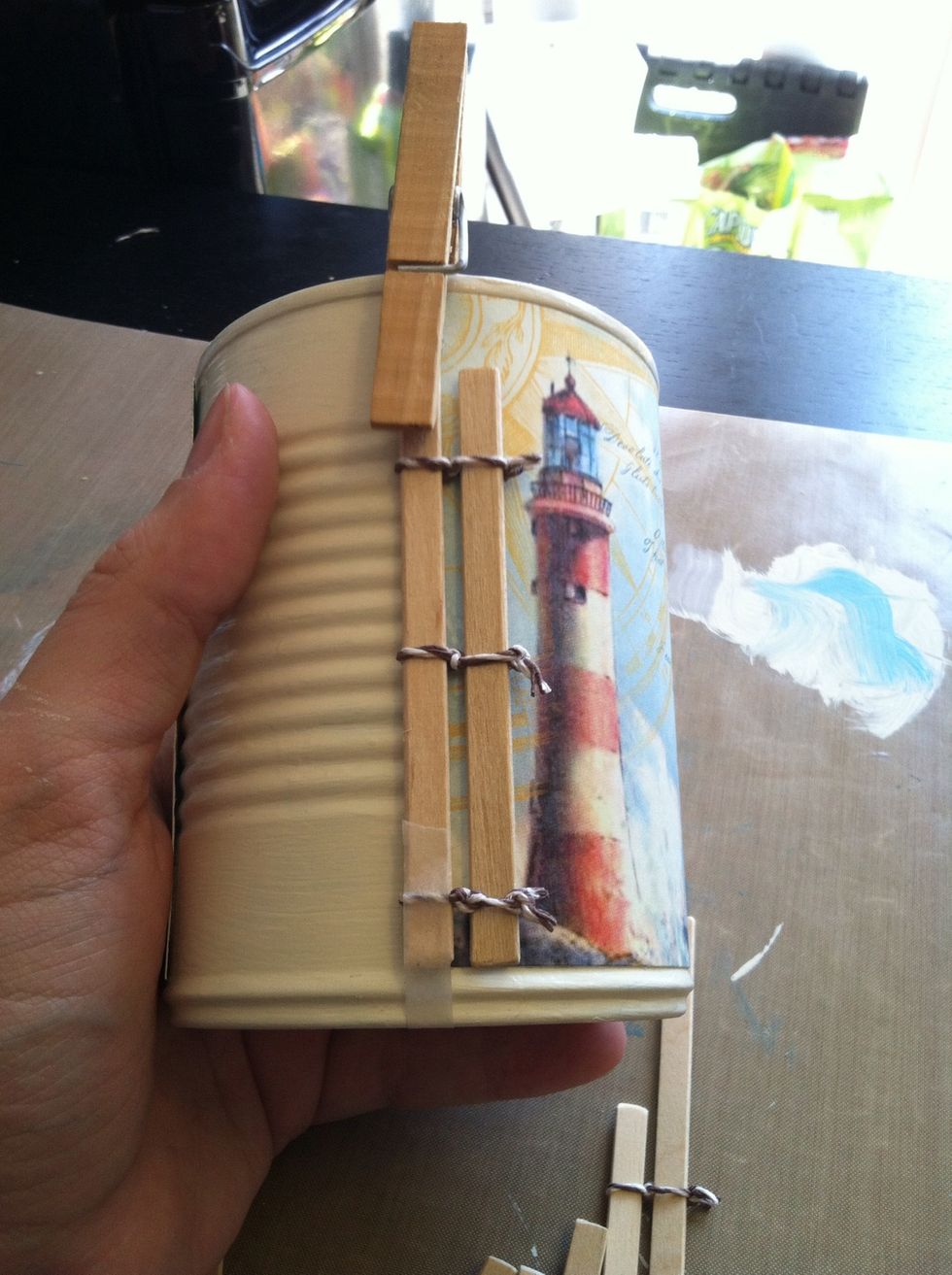You now have a couple inches of bare can. I covered this with a piece of plaid paper on the back of the "By the Sea" pattern. Do this before putting the wood down, unlike me.