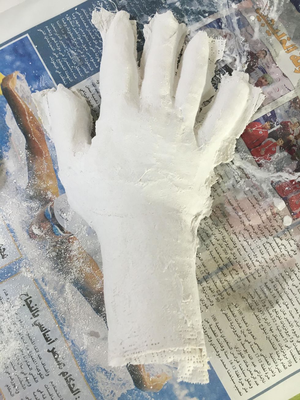 You now have a plaster cast of the top of your hand. Let them dry until Art class. We will paint them in class.Clean up your mess!