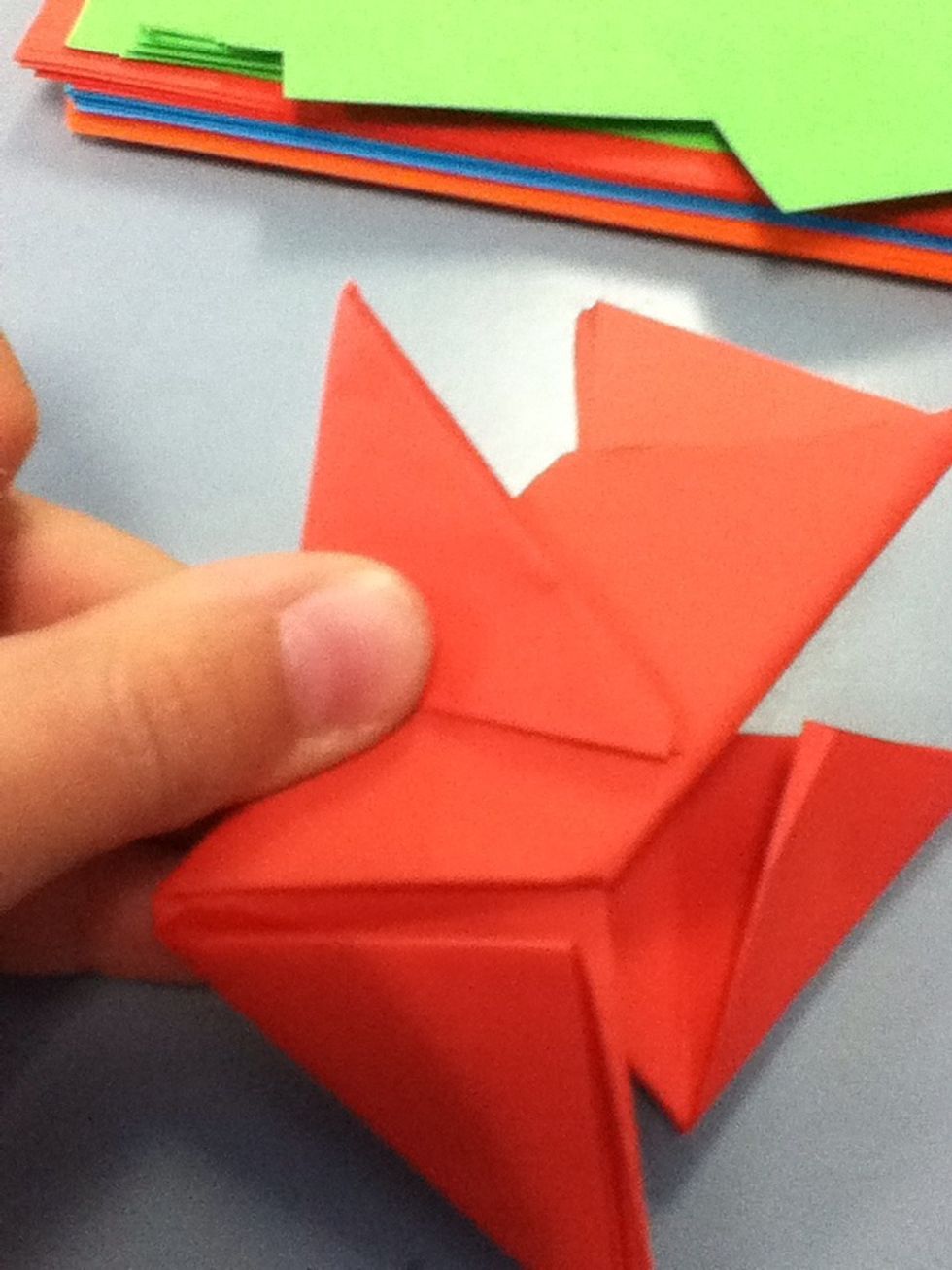 You now need to fold one of the flaps at the back down on to the front