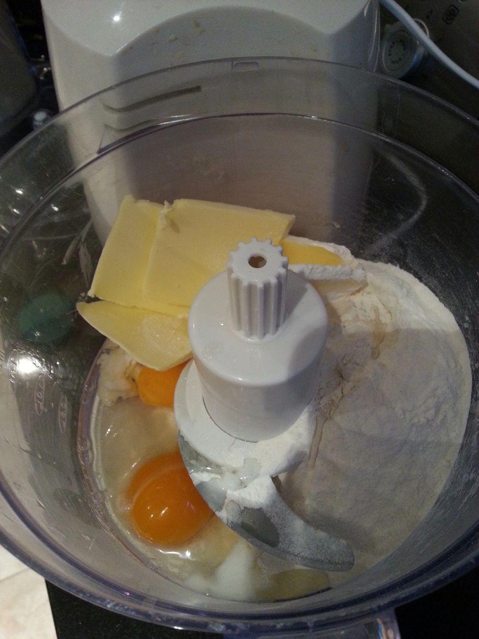 You now need to make the sponge. Mix the remaining ingredients (flour, baking powder, butter, caster sugar, eggs and milk) all together.
