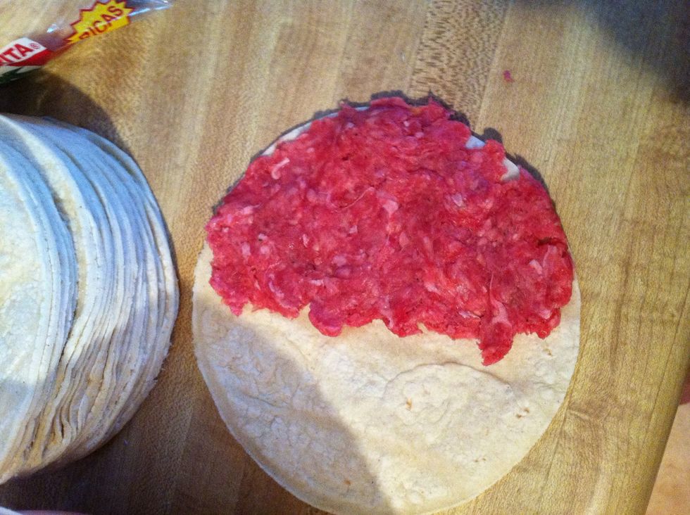 You only want to cover half of the tortilla so you can fold it in half.