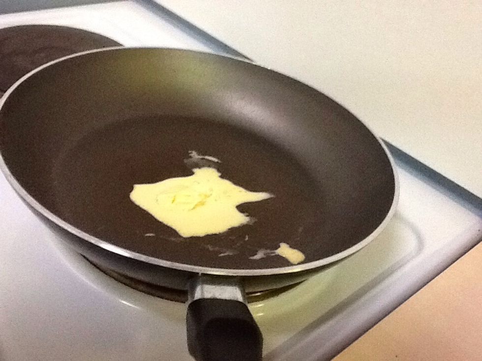 You put some butter in a pan.