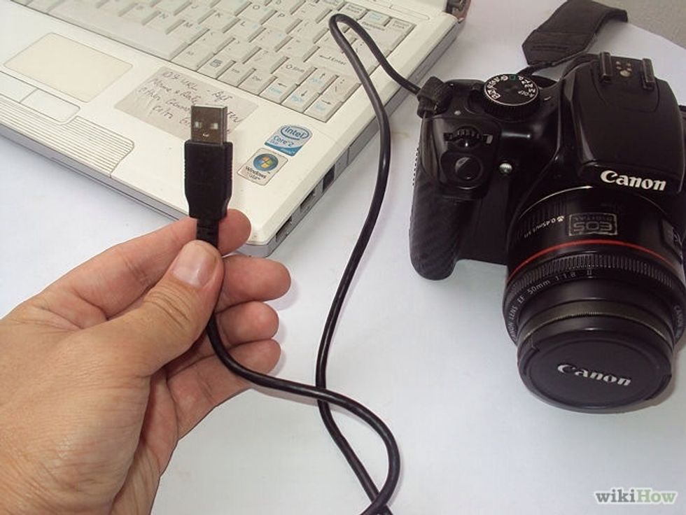 You put the camera cord and in the computer