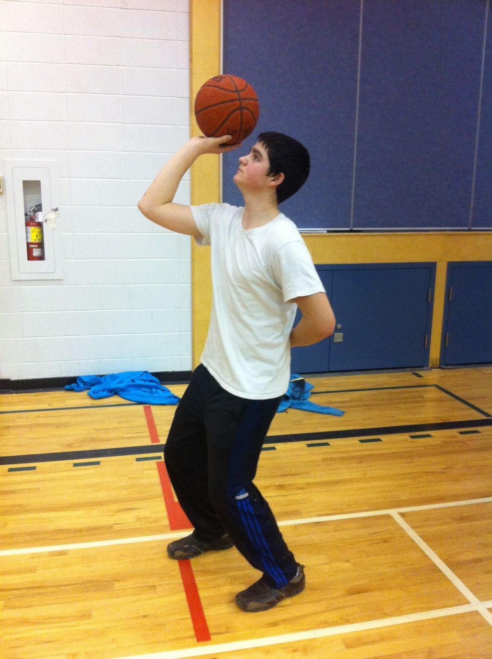 You put your guide hand behind your back ad shoot with one hand. This drill forces you to practice good form as well as helping teach you to flick your wrist and put back spin on the ball.