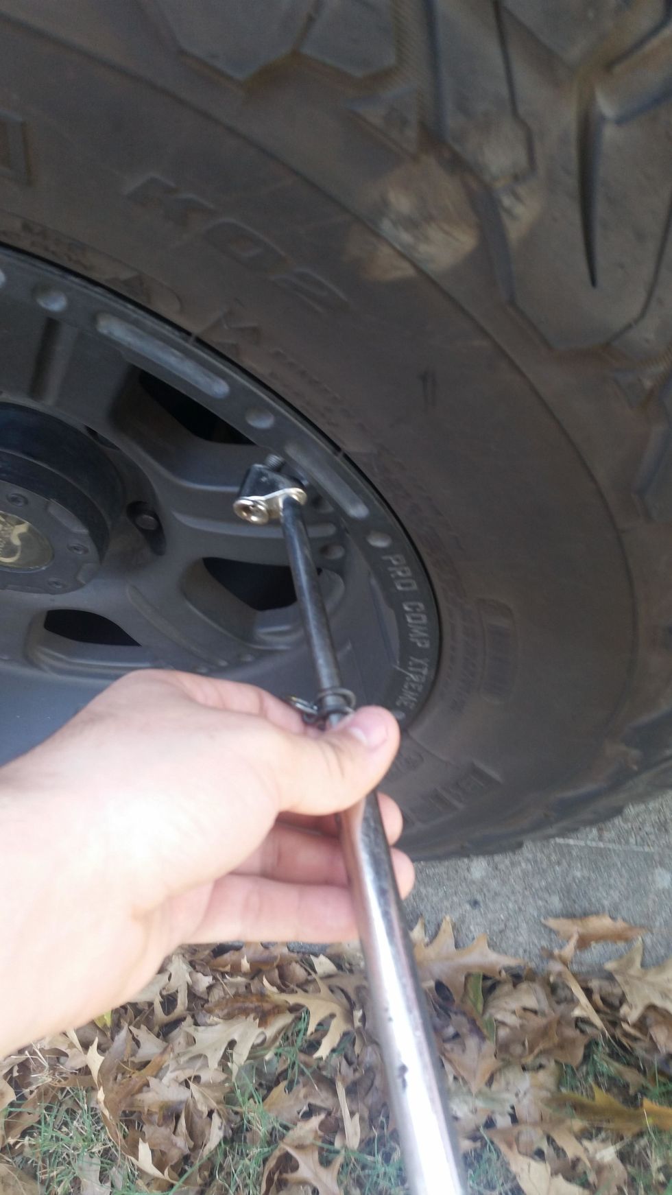 You put your tire pressure gauge and apply some force and release.