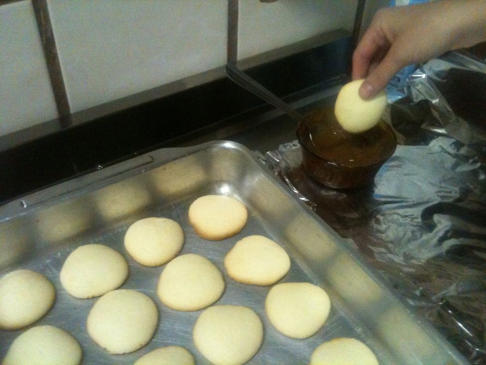You're going to dive half of the cookie in the melted chocolate