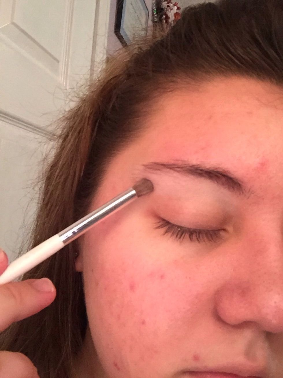 You're then going to apply it right below the eyebrows.