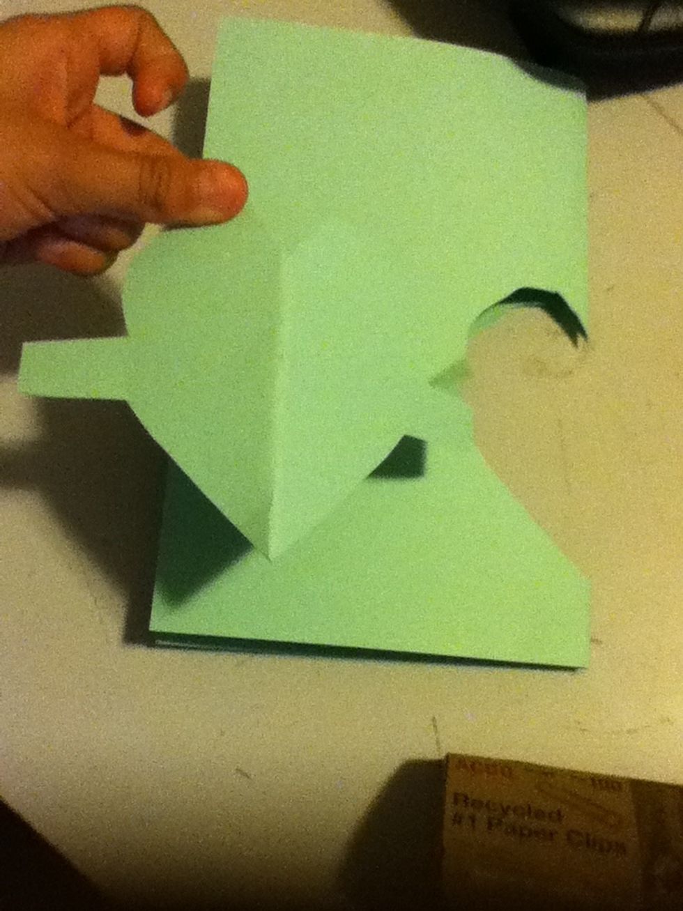 You should cut out a shape like this on one of the papers.