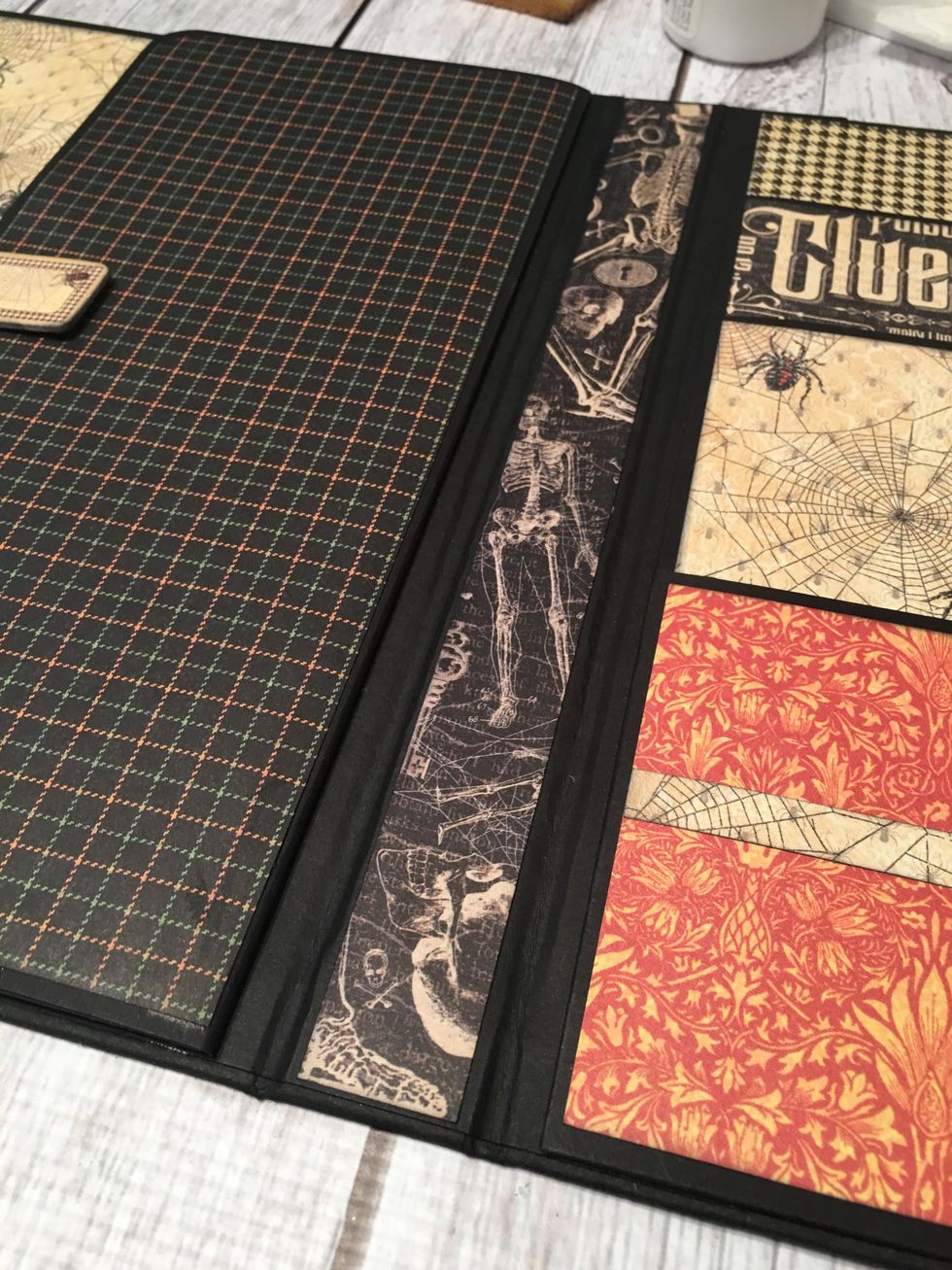 You should have already patterned the 1" spine area section. With the finished pockets on the right and the closure flap on the left, your album currently looks like this.