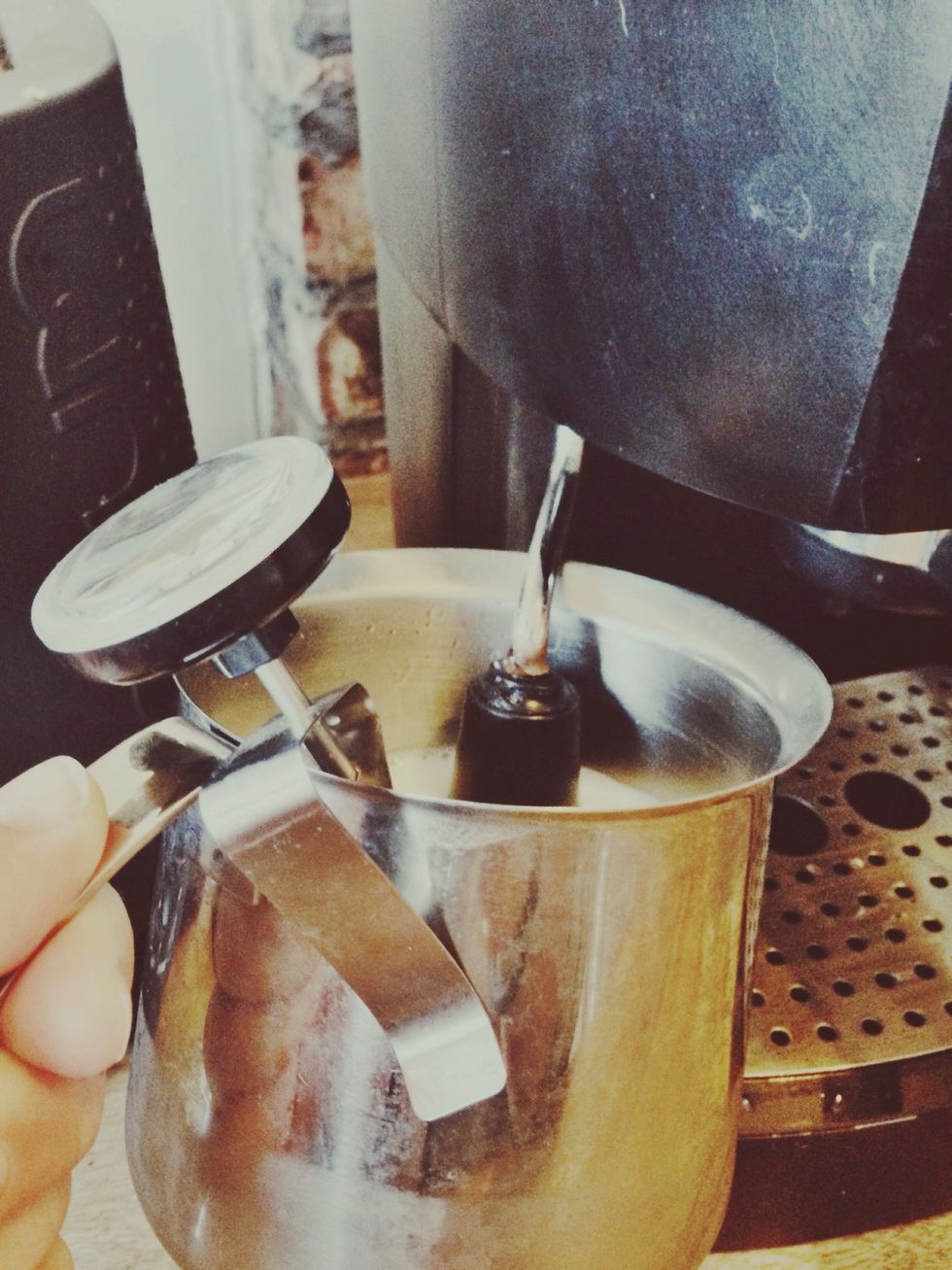 You should hear a soft whirring sound. If the sound is loud and obnoxious the wand is too far above the milk and if it's a deep rumbling sound it's too far inside the pitcher.